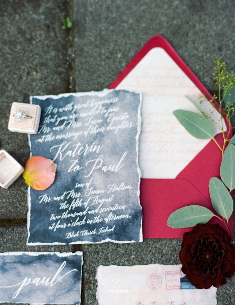 Grey wedding invitation with calligraphy